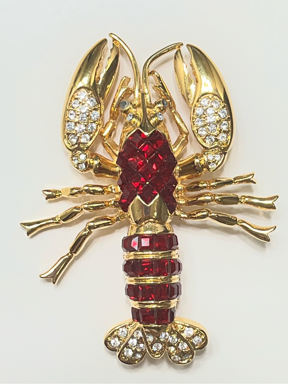 Nolan Miller Glamour Collection Gold Tone Ruby Lobster Swarovski Crystal Brooch
